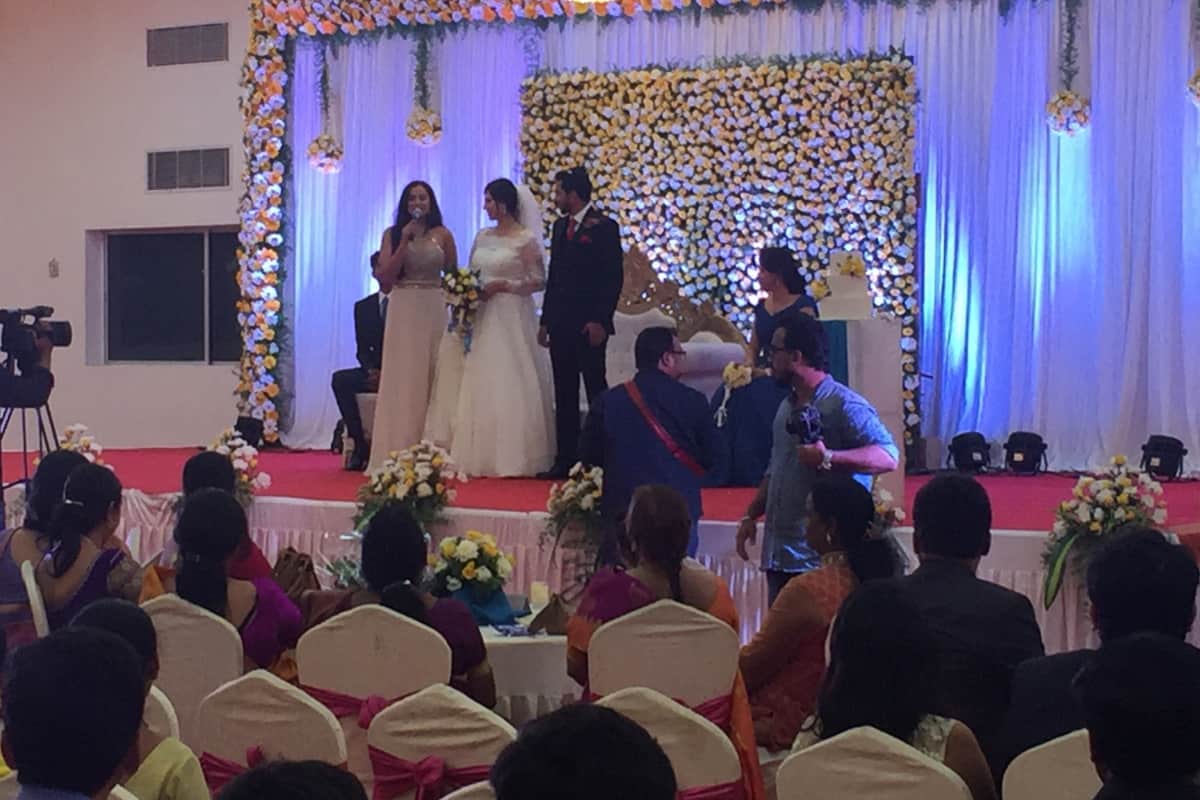 Multilingual MC Reena hosts Catholic Wedding reception